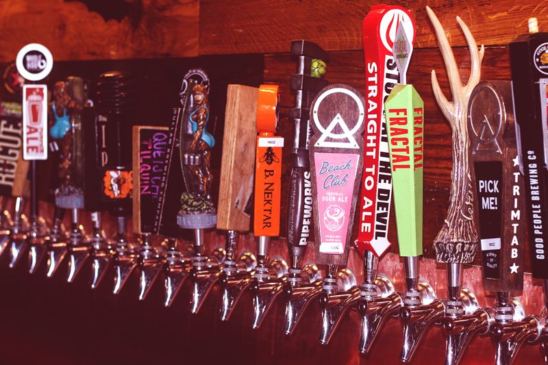 The Loosa Brews tap wall featuring TrimTab, Good People, B. Nektar, Pipeworks, and Beach Club Sour Ale